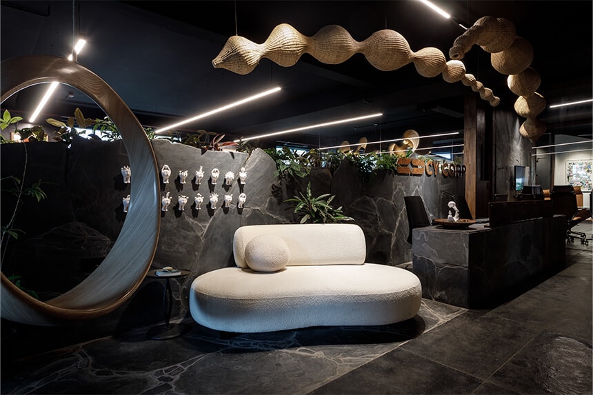 CY Corp studio lobby with sculptural seating and stone walls